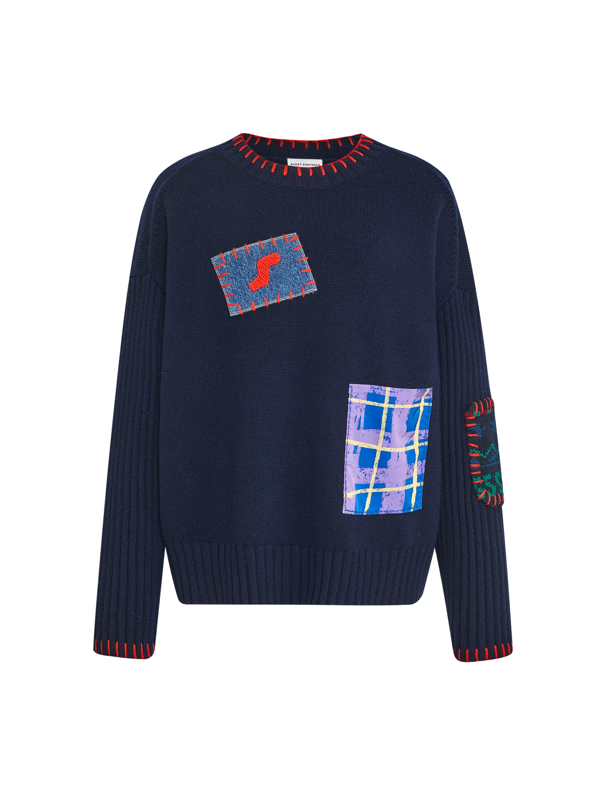 Pull avec écusson brodé à la main